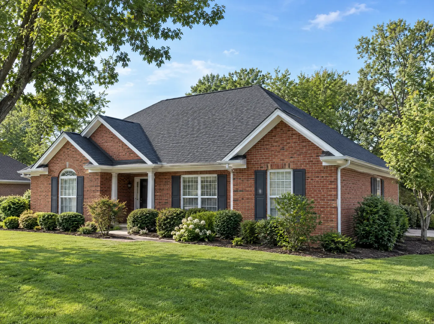 Brick ranch home with a new charcoal shingle roof