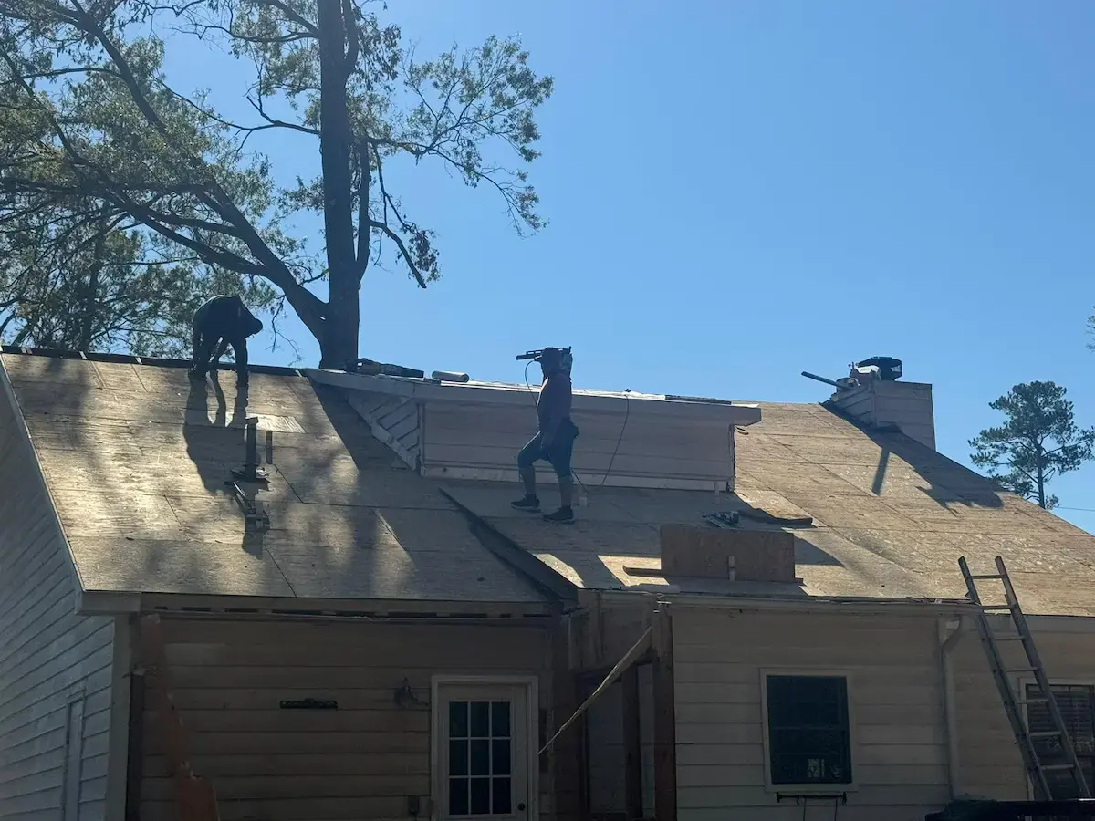 Roof Squirrel crew on a roof during a tear-off