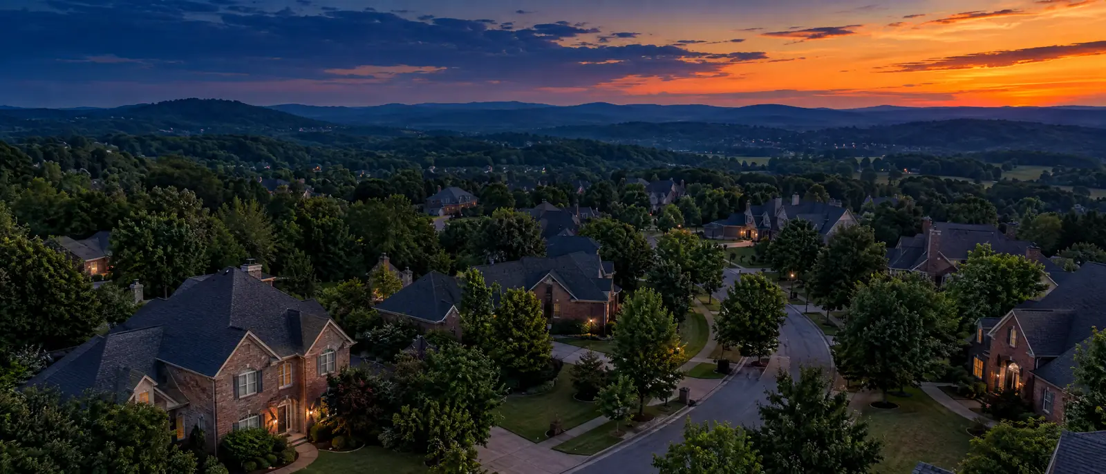 Tennessee neighborhood rooftops at dusk seen from above