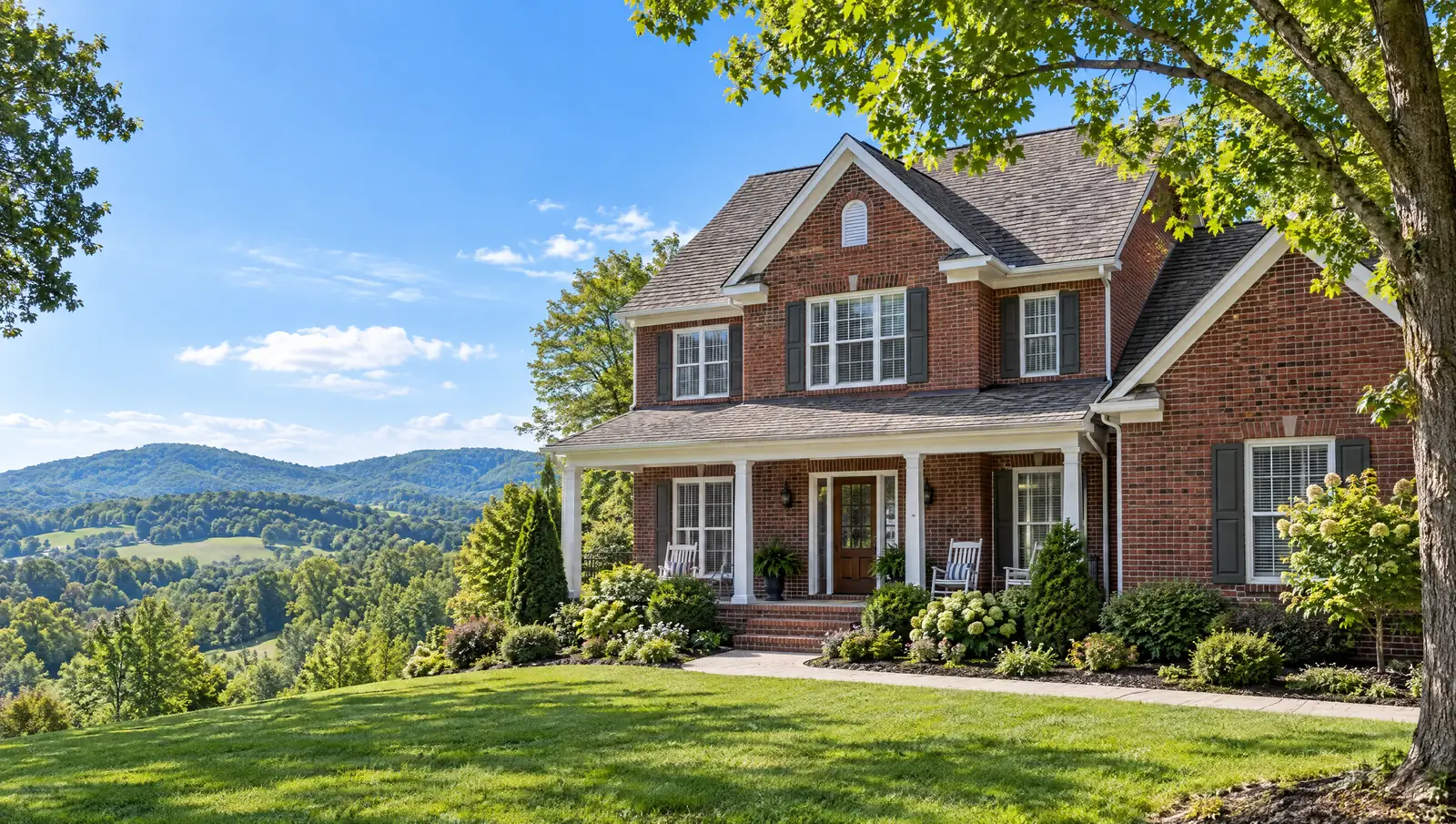 Brick home in a Tennessee neighborhood with a new roof and hills behind it